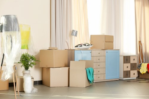 Packed office boxes and furniture ready for transport