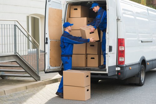 Professional packing team organising household boxes in a Fulham home