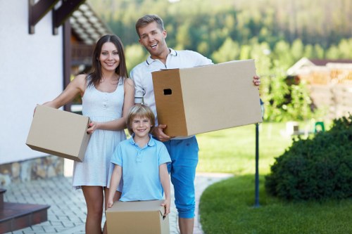 Careful loading of unwanted furniture during a Fulham pick-up service