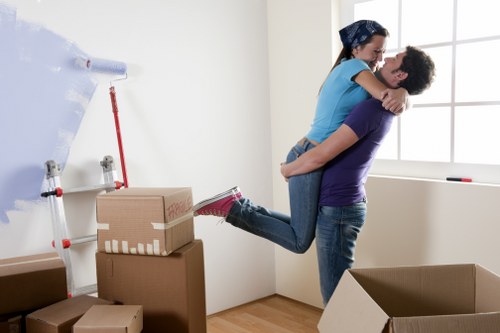 Unpacking boxes in a Fulham flat after a local relocation