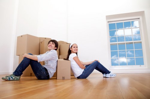 Moving furniture through a Fulham property with narrow access