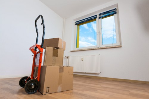 Office relocation scene showing desks and equipment ready for transport in Fulham