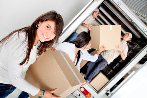 Office furniture and equipment being loaded for a Fulham commercial move