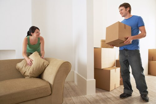 Moving team handling boxes during a van service